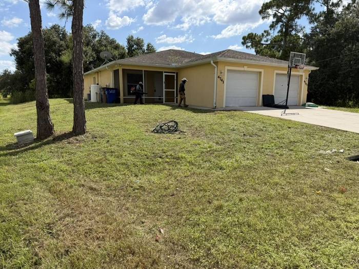 Trimmed lawn and landscaping at a single story home