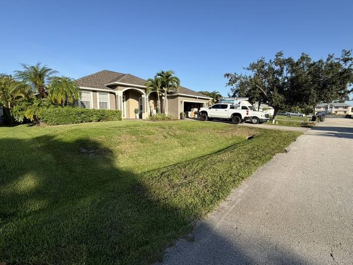 Mowed lawn edge along a driveway